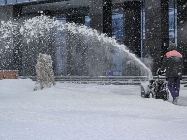 Handyman removing snow in Kings Beach, California